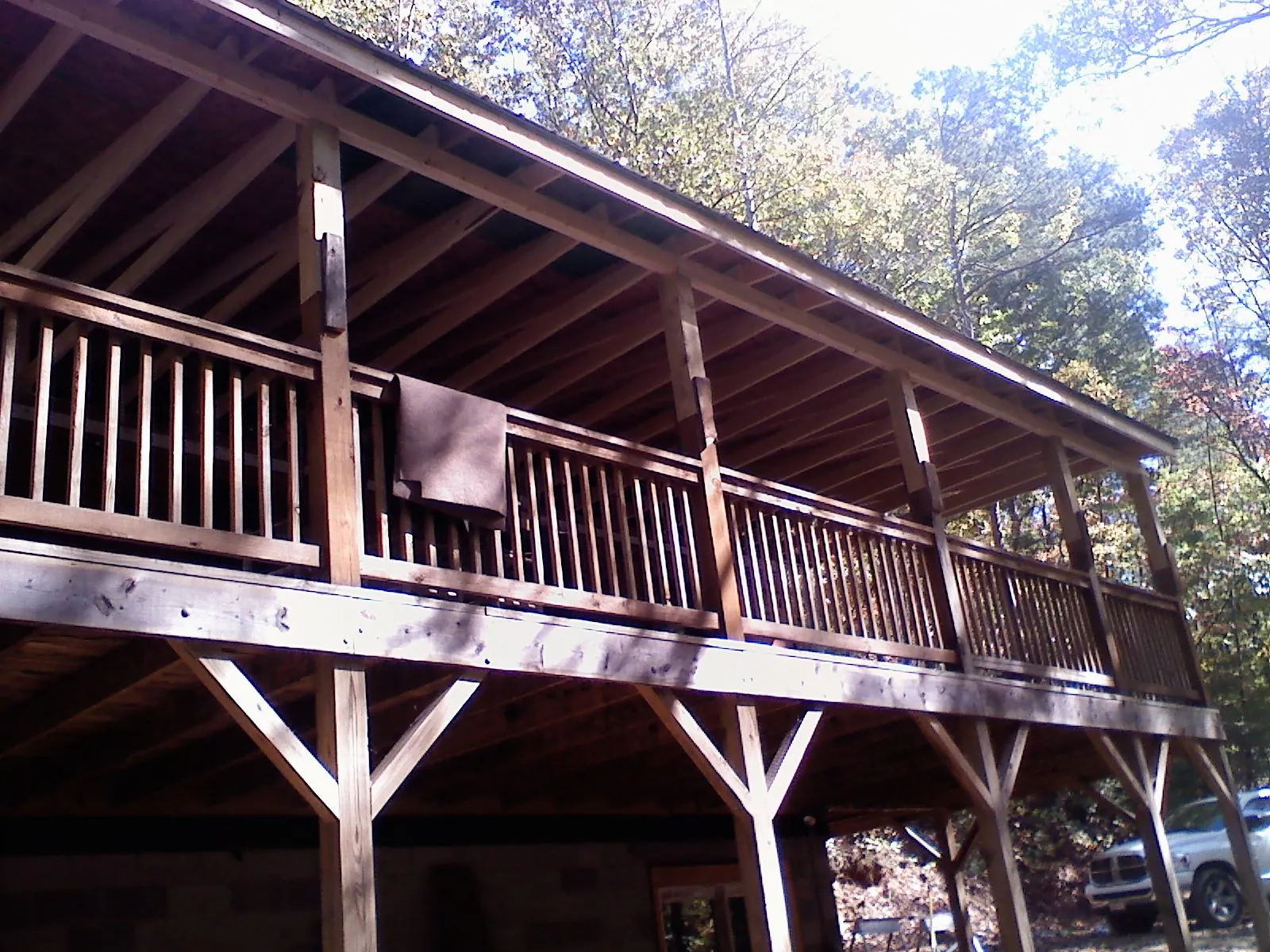 Timber framing under a new elevated porch and deck — Roof Leak Repair in Inwood by Roofing Brothers
